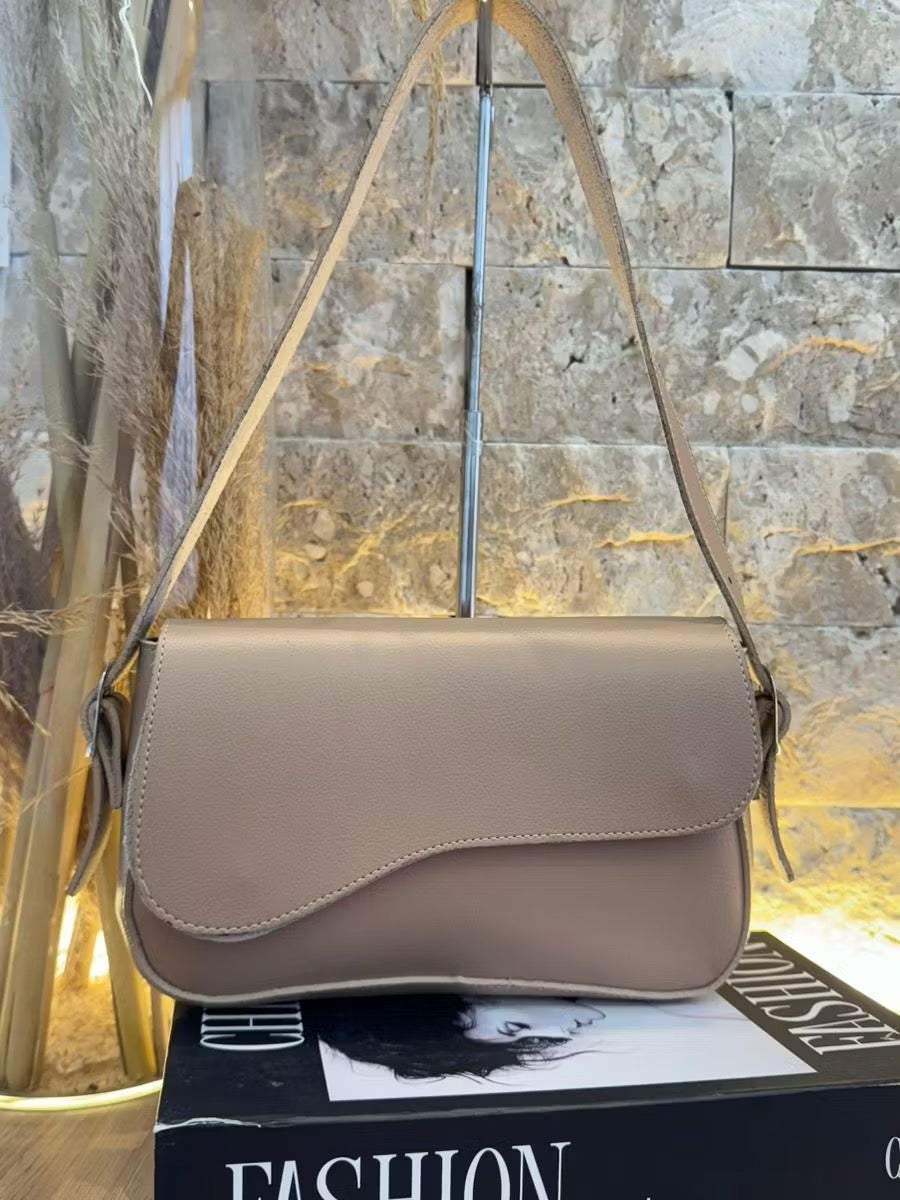 Bolsa tampa assimétrica