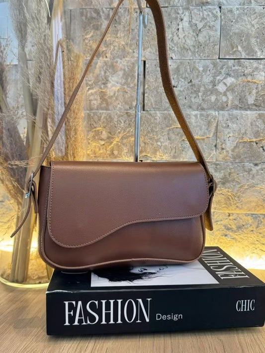 Bolsa tampa assimétrica