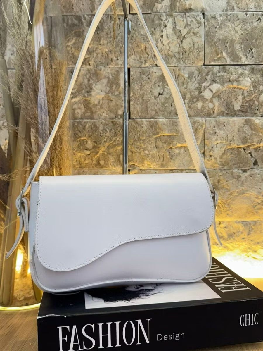 Bolsa tampa assimétrica